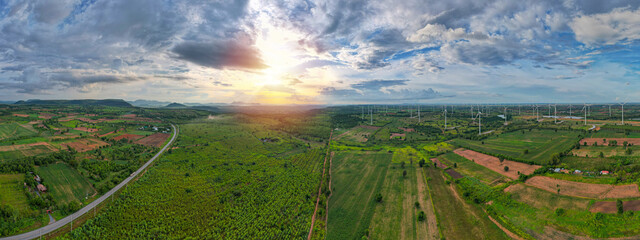 Panorama aerial view of countryside windmills, Agriculture fields and different variety of harvest, View of forest Aerial view of the sky, Panoramic beautiful landscape with sky on a sunny day.