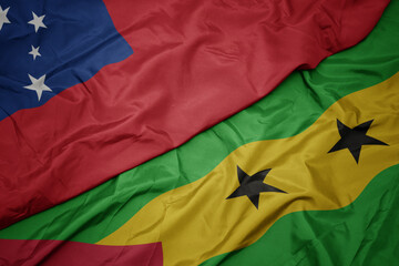 waving colorful flag of sao tome and principe and national flag of Samoa .