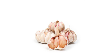 Several large heads of garlic, shot against a white background.