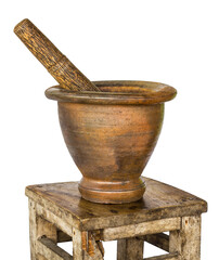 Isolates with clay mortar and pestle sits on a wooden bench beautiful old antique small. - obrazy, fototapety, plakaty