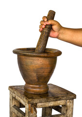 Isolates of obese women carrying handle pestle pounding the mortar is laid on the old antique bench.