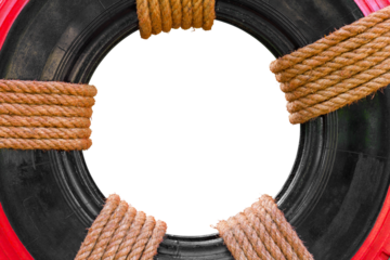 Close-up old car tires, which brought Recycling painted black and red tied with a rope Manila.