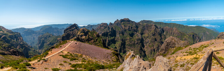 Fototapeta na wymiar Panoramic on the trail for trekking in the mountains at Pico do Arieiro, Madeira. Portugal