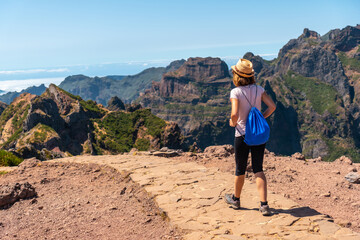 Fototapeta premium A tourist on the trekking trail at Pico do Arieiro, Madeira. Portugal