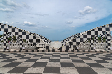 The Chennai Napier Bridge has been transformed into a chessboard in preparation for the 44th Chess Olympiad 2022.Napier Bridge has the look of a chess board. - obrazy, fototapety, plakaty