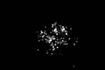 White gray blurred bokeh lights on black background. Glitter sparkle stars for celebrate. Overlay for your design