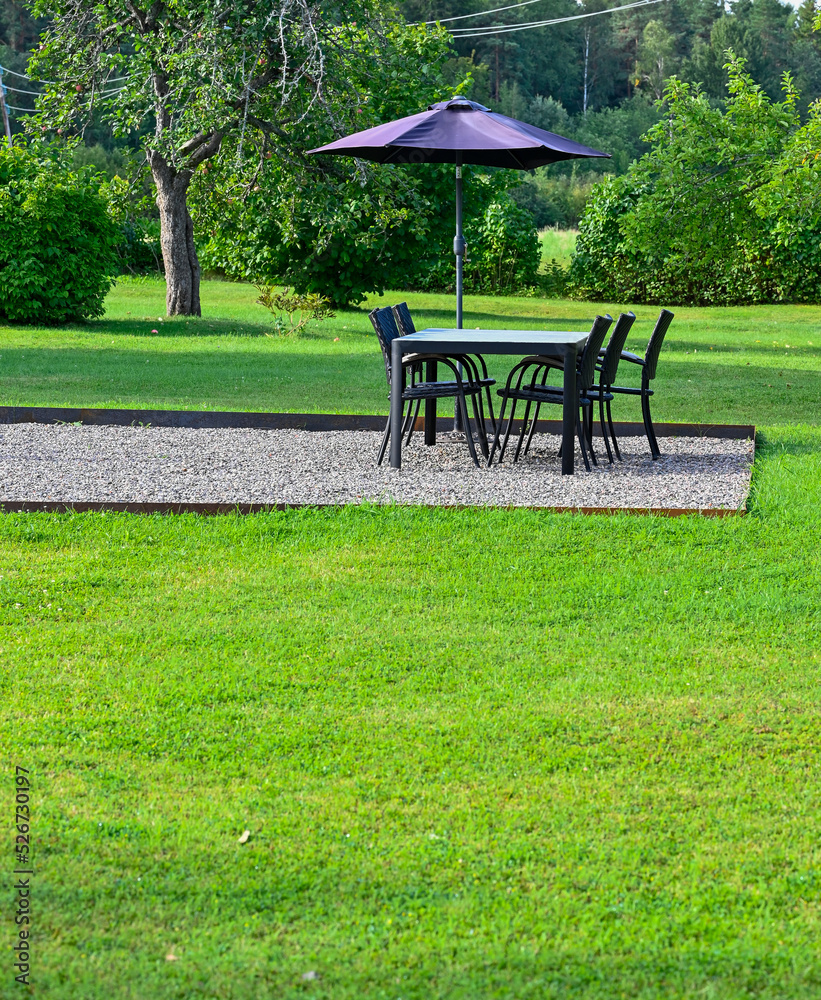 Wall mural garden furniture with one table and four chairs