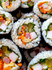 Kimbap, a Korean food. Gimbap is a food made with various ingredients rolled into seaweed together with rice.