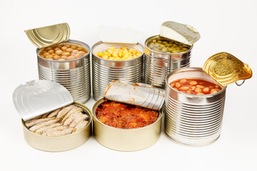 Vegetable and fish canned food on a white background. Food for hikers.