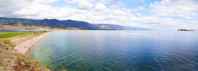 Beautiful seascape. Lake Baikal in summer. View of the bay and islands near the village of Kurma. Panorama