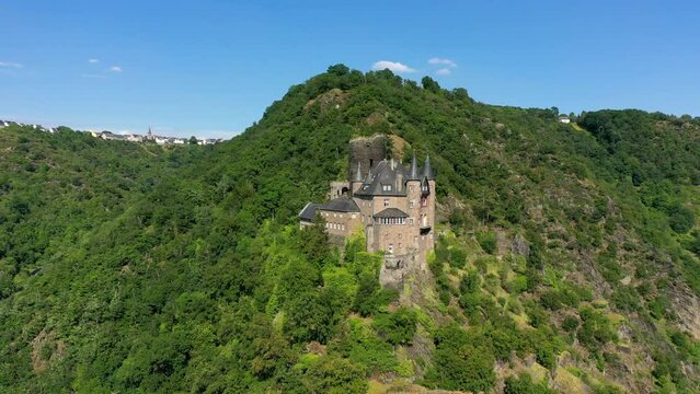 Katz castle and romantic Rhine in summer at sunset, Germany. Katz Castle or Burg Katz is a castle ruin above the St. Goarshausen town in Rhineland-Palatinate region, Germany