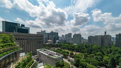 Time lapse of office building by Hibiya Park in Tokyo, Japan