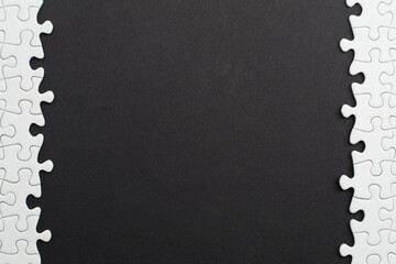 Close-up of blank white jigsaw puzzle texture background