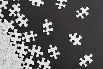 Close-up of blank white jigsaw puzzle texture background