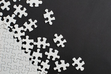 Close-up of blank white jigsaw puzzle texture background