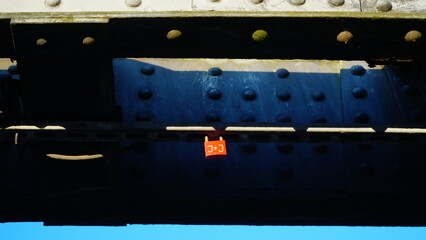 Red padlock on the iron structures of the bridge
