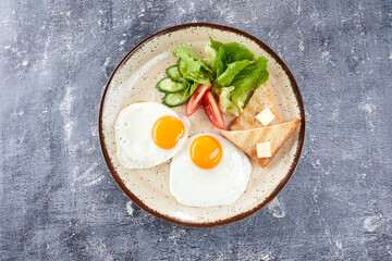 fried egg with toasts and salad