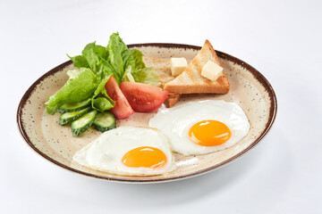 fried egg with toasts and salad