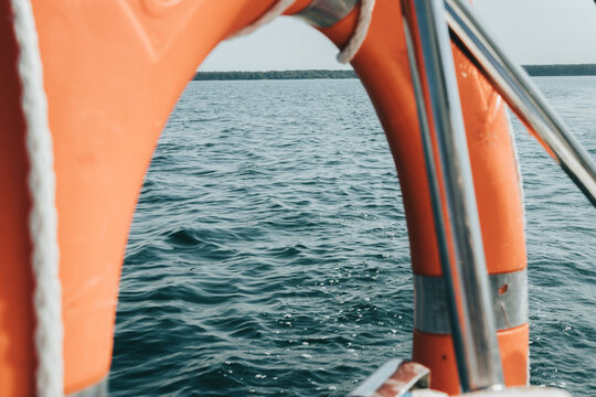 sailing yacht goes on the lake. photo from the yacht. lake and horizon view.