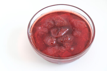 Homemade strawberry jam inside bowl. Selective focus. Copy space area.