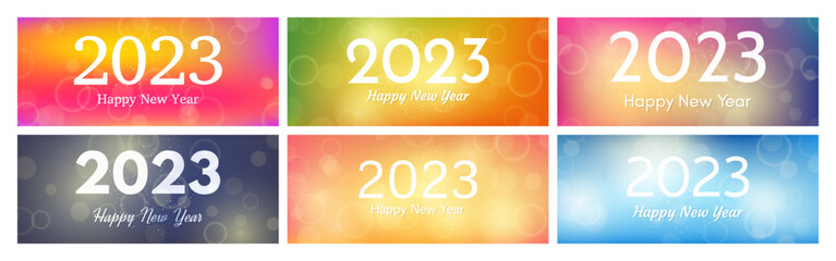 Happy new year 2023 incription on blurred background