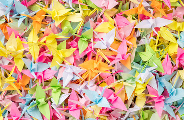A group of colorful tsuru origamis. Japanese thousand tsurus legend