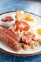 traditional breakfast with fried egg and toasts
