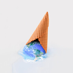 Planet Earth dripping from overturned ice cream cone on beige background. Minimal abstract melting...