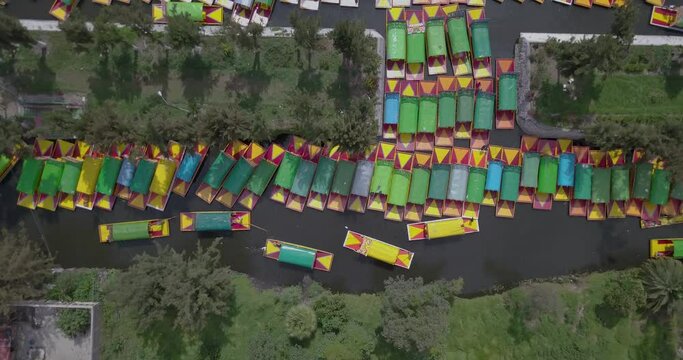 Beautiful aerial cinematic footage of the Xochimilco lake and its traditional boats in Mexico 