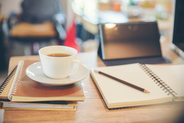 Desk for student education concept. Stationery, Book, tablet, and pencil for study for exam placed on wooden School table for student plan to work at home.