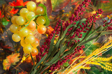 Different autumn fruits among the leaves, top view