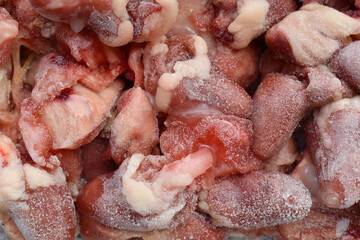 Frozen chicken giblets (hearts and gizzards) background