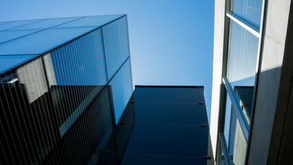 Fototapeta premium Modern buildings on the blue sky background 