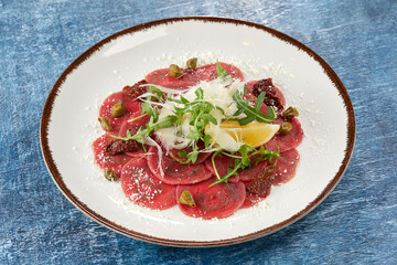 beef carpaccio with cheese and capers