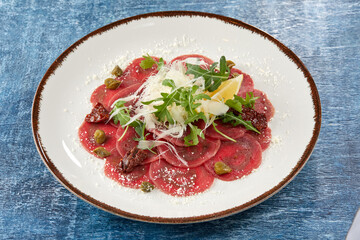beef carpaccio with cheese and capers