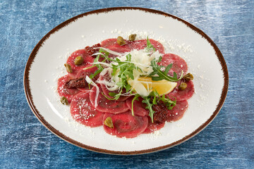 beef carpaccio with cheese and capers
