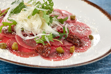 beef carpaccio with cheese and capers