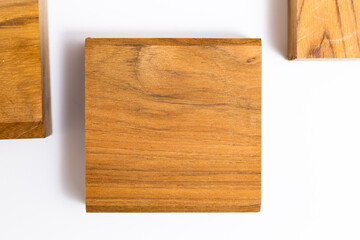 Natural Teak wood cube on white background