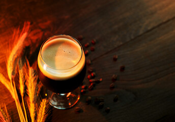 A glass of dark craft beer, coffee cream stout.