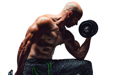 Strong young man bodybuilder performing exercise for biceps with heavy weights in both hands on...