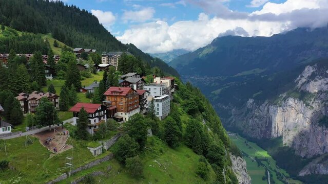 Village of Murren in the Swiss Alps. Village Murren surrounded by mountain peaks of Alps. Murren mountain village with Lauterbrunnen Valley and Swiss Alps, Jungfrau region, Switzerland, Europe.