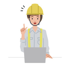 デスクで座ってPCを開いて何かひらめいた工事現場の女性