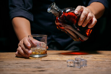 Barman pouring whiskey whiskey glass beautiful night