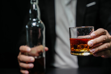 Barman pouring whiskey whiskey glass beautiful night