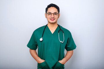 Professional good-looking asian doctor, medical worker in glasses and scrubs, cross arms and smiling