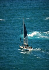 Naklejka premium Boat with sail on sea