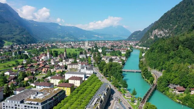 Aerial view over the city of Interlaken in Switzerland. Beautiful view of Interlaken town, Eiger, Monch and Jungfrau mountains and of Lake Thun and Brienz. Interlaken, Bernese Oberland, Switzerland.
