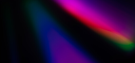 Abstract Rainbow light trails on the dark background