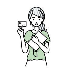 立って書類とカードを手に持つオフィスカジュアルの女性