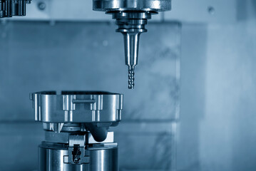 The  4-axis  machining center cutting the aluminum gear housing parts.